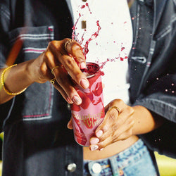 Opening Daughters of the Vine can with splash effect